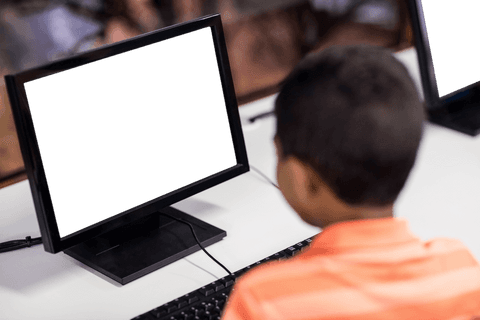 young boy sitting before transparent monitor emulating blank screen - Download Free Stock Videos Pikwizard.com