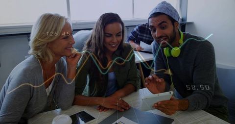 Multigenerational team collaborating on tablet with data visualization and analytics