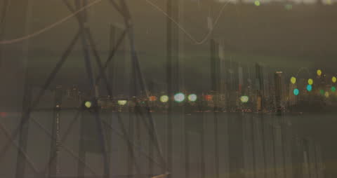 Financial Data Overlaid on Cityscape at Night Creating Abstract Skyline