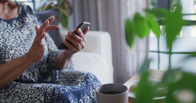 Senior Woman Using Smartphone While Relaxing at Home - Download Free Stock Images Pikwizard.com