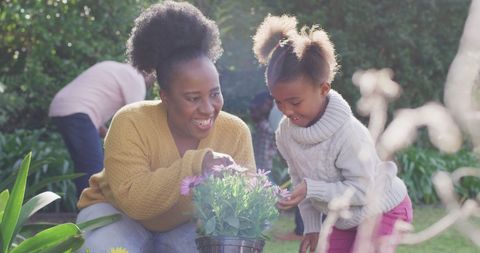 Family Gardening Together on a Sunny Day