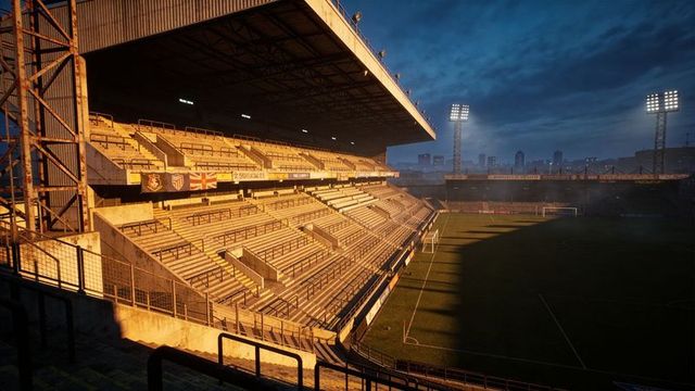 Sunlit stadium grandstand at twilight with city skyline, floodlights and empty terraces
