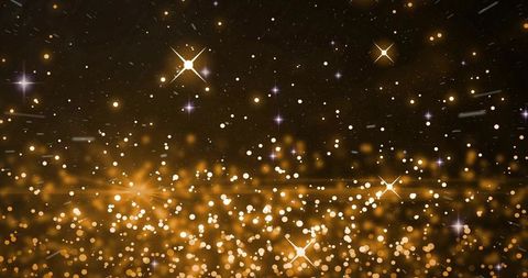 Glowing Golden Bokeh and Starburst Sparkle Background for Festive Luxury Design