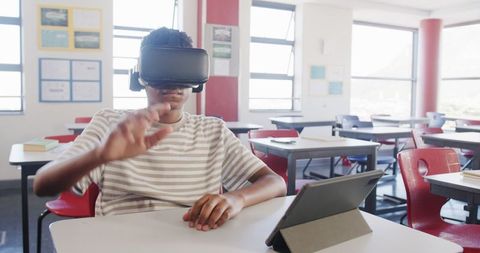 Student Exploring Technology with VR Headset in Classroom