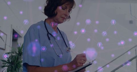 Nurse Interacting with Digital Medical Network Interface