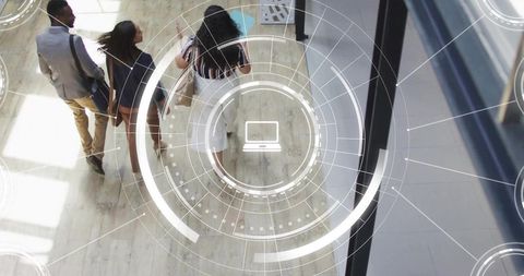 Business team walking through modern office lobby with digital hud overlay
