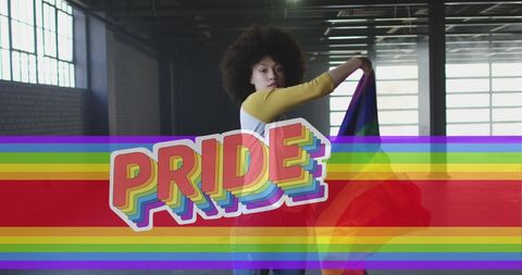 Pride Celebration with Woman Waving Rainbow Flag Indoors