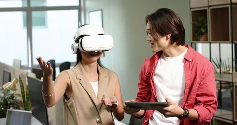 Diverse Team Collaborating with VR Technology in Modern Office Space