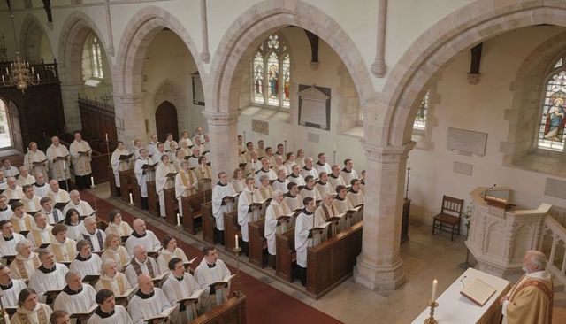 Singing choir in white robes filling historic stone nave with priest presiding at altar