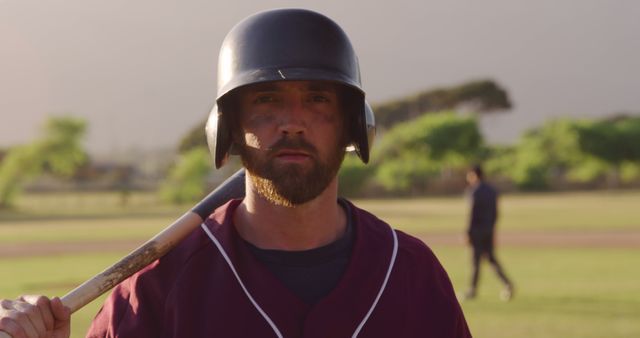 Baseball player holding bat wearing helmet on field - Download Free Stock Images Pikwizard.com