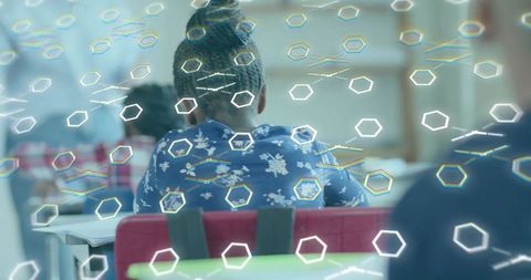 Student using augmented reality in classroom with hexagonal holograms and future learning