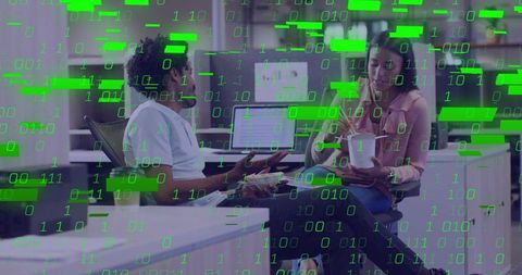 Diverse Coworkers Collaborating in Modern Office with Green Binary Overlay for Tech