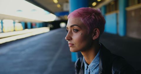 Caucasian Woman with Pink Hair at Train Station - Download Free Stock Images Pikwizard.com