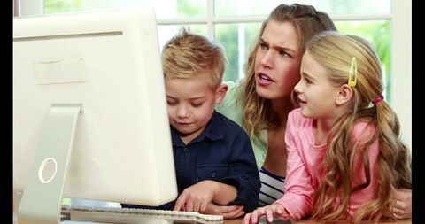 Mother and Children Solving Problem on Computer - Download Free Stock Images Pikwizard.com