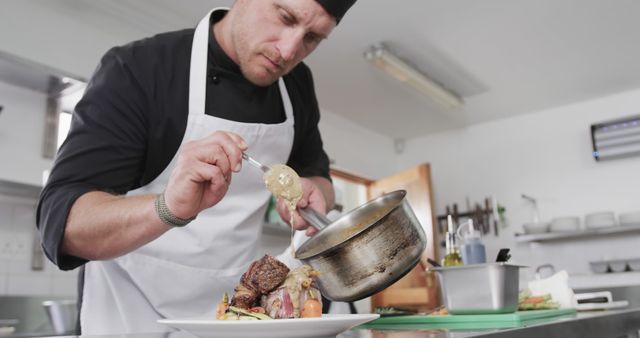 Focused Chef in Professional Kitchen Plating Gourmet Dish - Download Free Stock Images Pikwizard.com