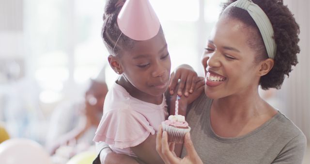 Mother and Daughter Celebrate Birthday with Joyful Cake Moment - Download Free Stock Images Pikwizard.com