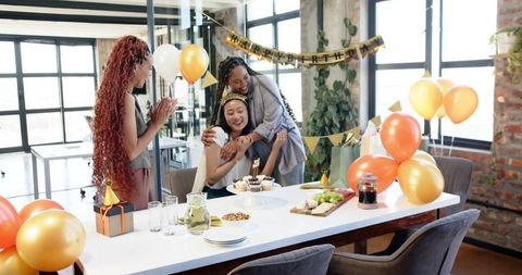 Three Multiracial Women Celebrating Birthday in Office Environment