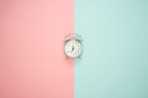 Retro Alarm Clock on Pastel Color Background