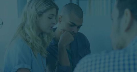 Young Professionals Engaged in Workplace Discussion