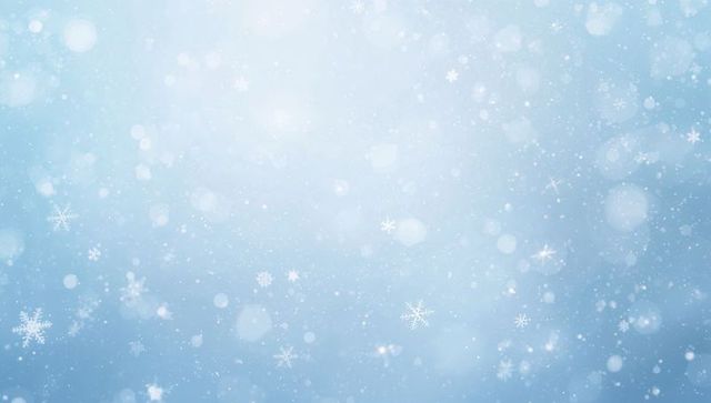 Soft falling snowflakes with bokeh glow on pale blue gradient winter backdrop