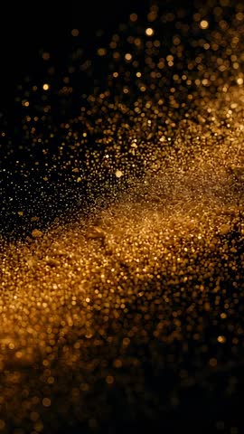 Drifting golden particles forming bokeh ribbon in vertical macro video, warm shimmer glow