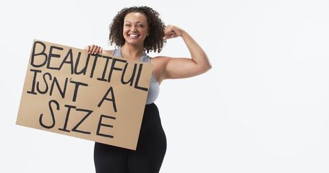 Confident woman celebrating body positivity and strength