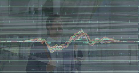 Business Professional Analyzing Financial Trends and Graphs