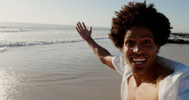 Happy Man Enjoying Beach Vacation on Sunny Day - Download Free Stock Images Pikwizard.com