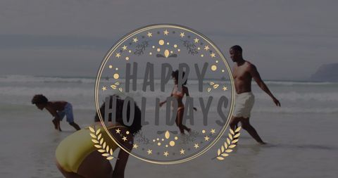 Happy Holidays Text Overlay on Family Beach Scene