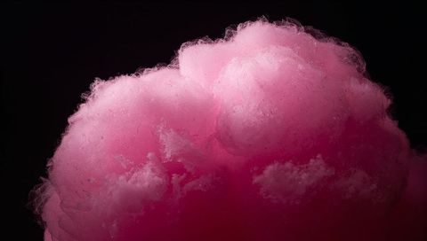 Fluffy Pink Cotton Candy Cloud Floating Macro with Tufted Texture and Sugar Wisps