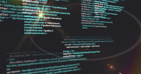 JavaScript Code on Monitor with Coffee Stain and Ambient Lighting