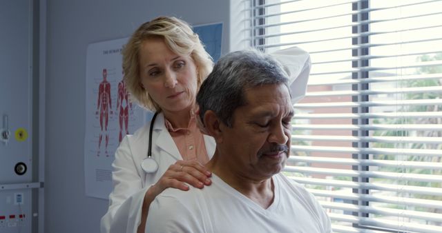 Doctor Examining Middle-Aged Man in Medical Office - Download Free Stock Images Pikwizard.com