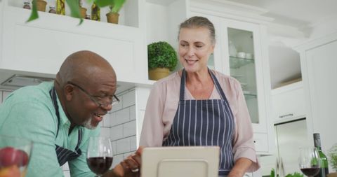 Senior Couple Cooking Together in Kitchen Using Tablet - Download Free Stock Images Pikwizard.com