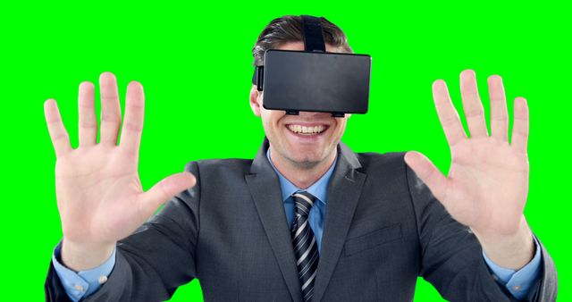 Man Wearing VR Headset Smiling with Hands Raised Against Green Screen Background - Download Free Stock Images Pikwizard.com