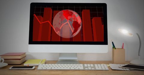 Work Desk with Computer Displaying Global Economic Graphs - Download Free Stock Images Pikwizard.com