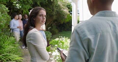 Guests Socializing at Outdoor Garden Wedding Celebration