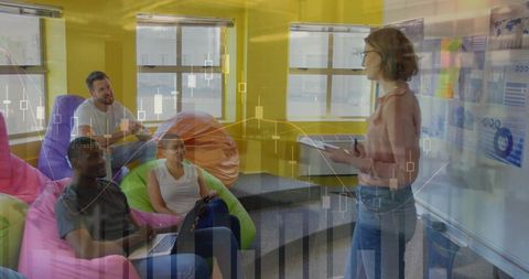 Creative Team Collaboration in Modern Office with Data Visualization