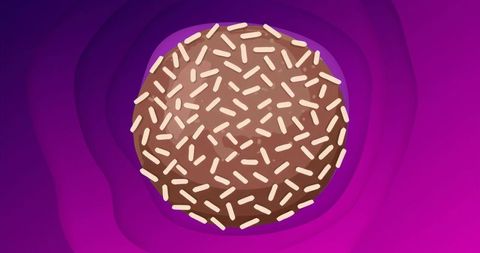 Chocolate donut with cream sprinkles on abstract purple background