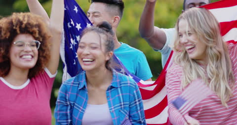 Diverse Group of Friends Celebrating with American Flags
