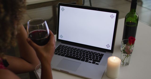 Person Enjoying Wine and Candlelight While Working on Laptop at Home - Download Free Stock Images Pikwizard.com