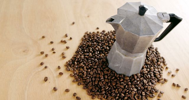 Vintage Moka Pot Surrounded by Coffee Beans on Wooden Table - Download Free Stock Images Pikwizard.com