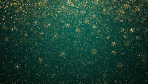 Golden snowflakes drifting over deep teal bokeh background for festive holiday design