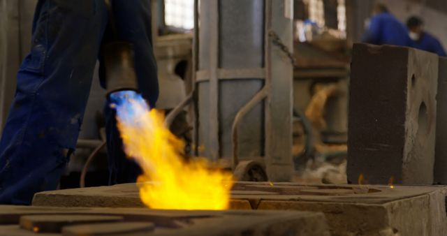 Industrial Worker Using Blowtorch in Factory Workshop - Download Free Stock Images Pikwizard.com