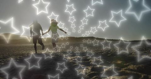 Couple Running on Beach with Glowing Stars at Sunset