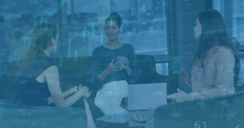 Diverse Business Team Discussing Financial Data Insights in Office