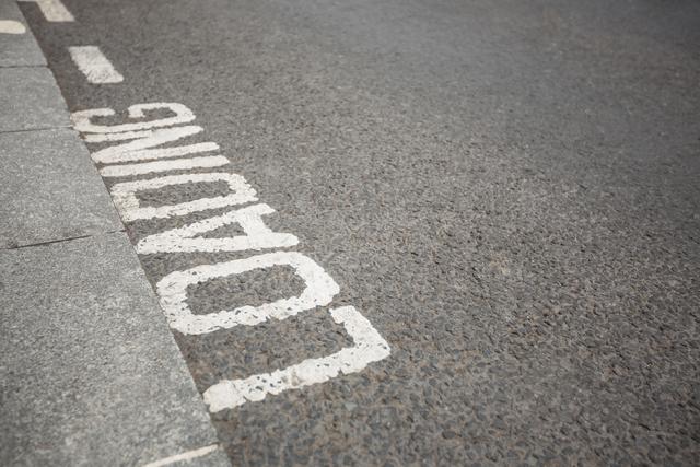 Close-up of text written on road surface