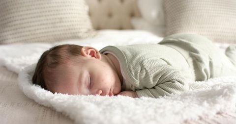 Peaceful sleeping infant cozy bedroom tranquility