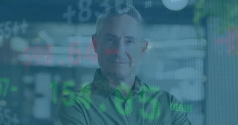 Caucasian Businessman Overlaid with Financial Data in Modern Office