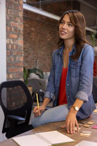Creative woman in loft office inspiring design ideas