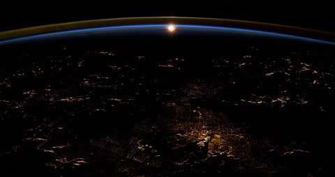 Sunrise from Space: City Lights Visible on Curved Earth